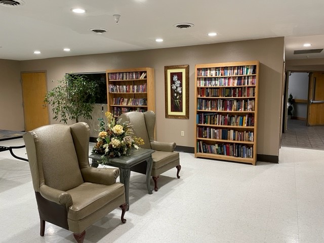Common area with seating and bookshelves
