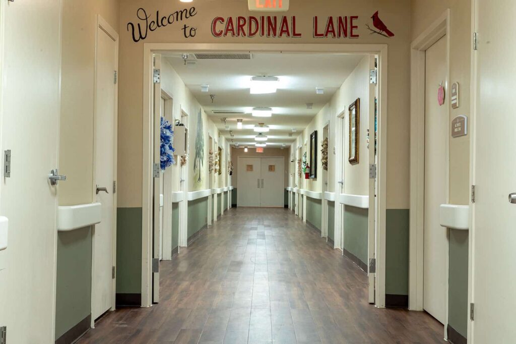 Interior hallway with signage for Cardinal Lane