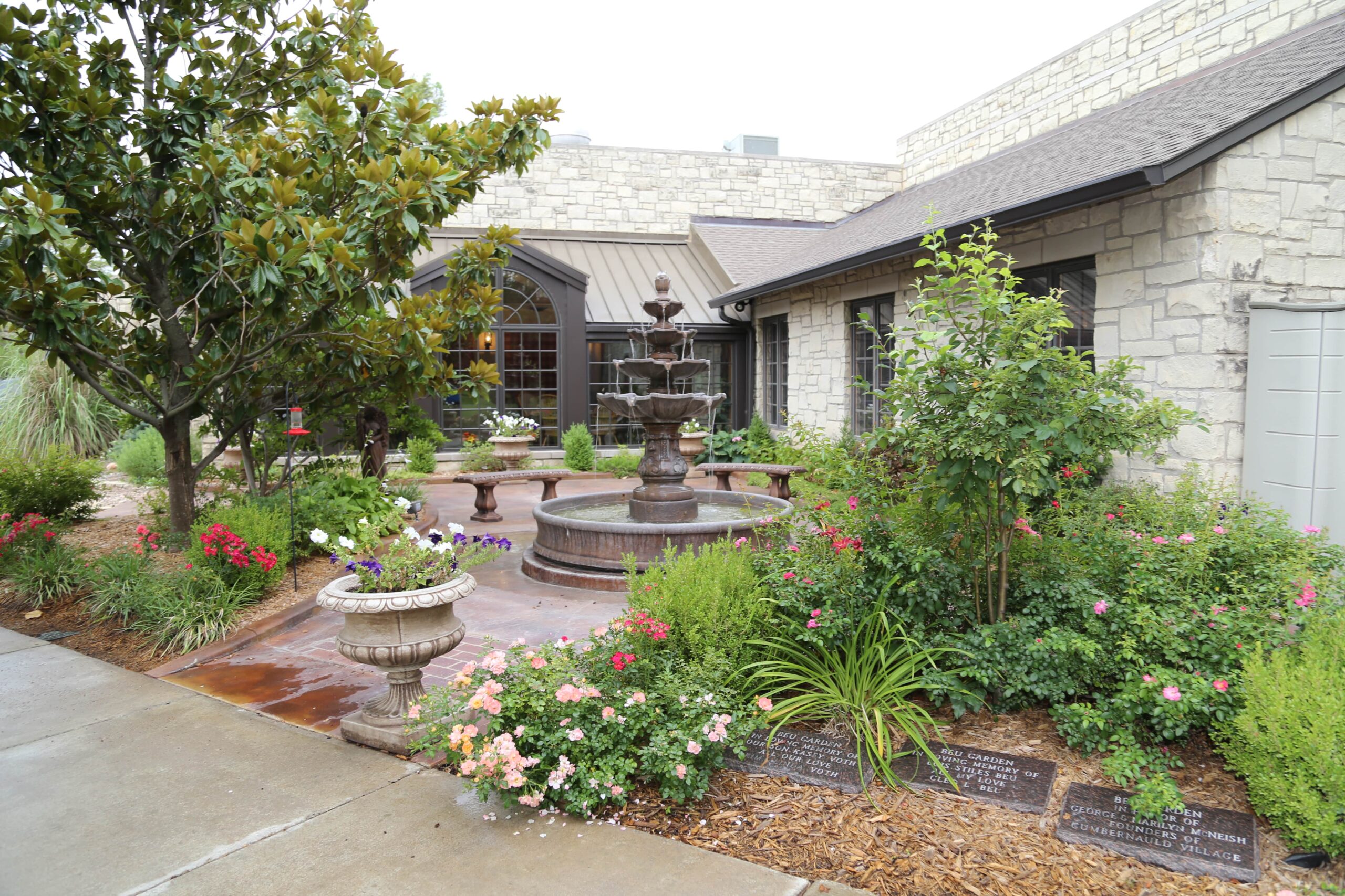 Beautiful outdoor space with a fountain and flowers