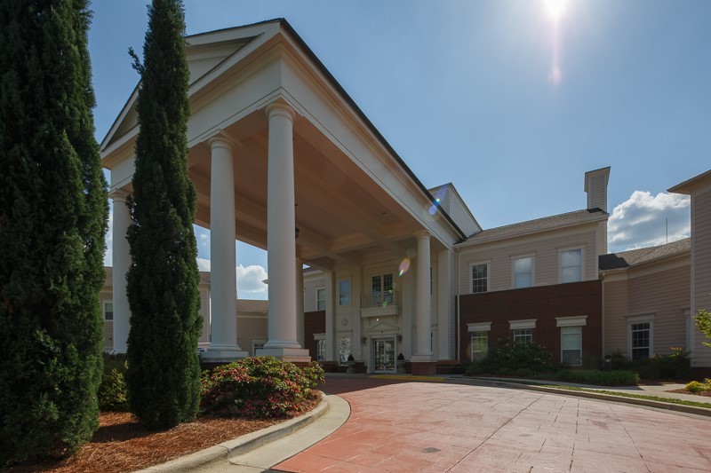 Exterior view of OakBridge Terrace entrance with columns