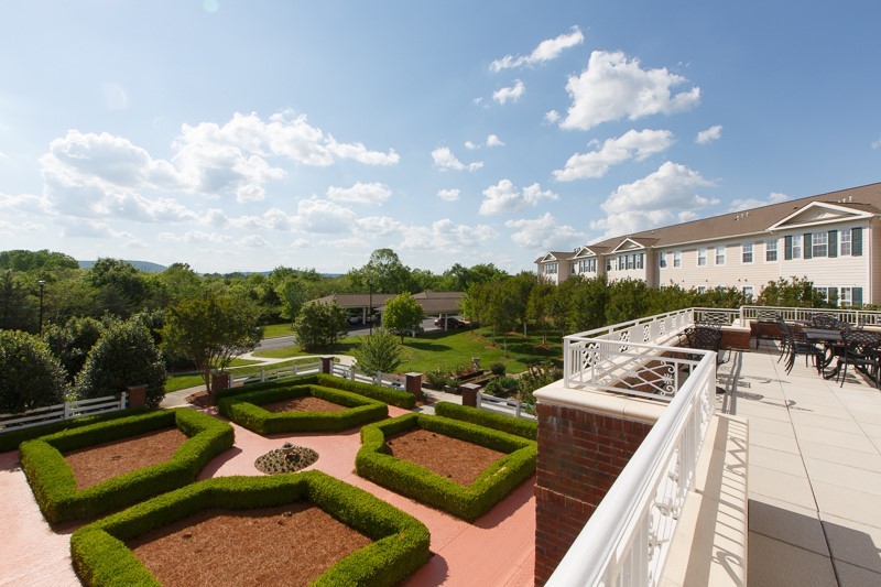 View of landscaped outdoor space and building exterior