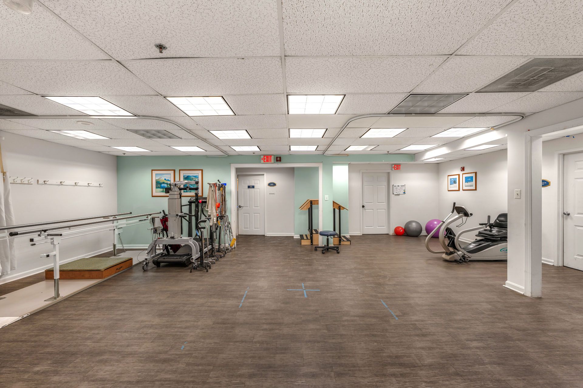 Physical therapy room with equipment and exercise area