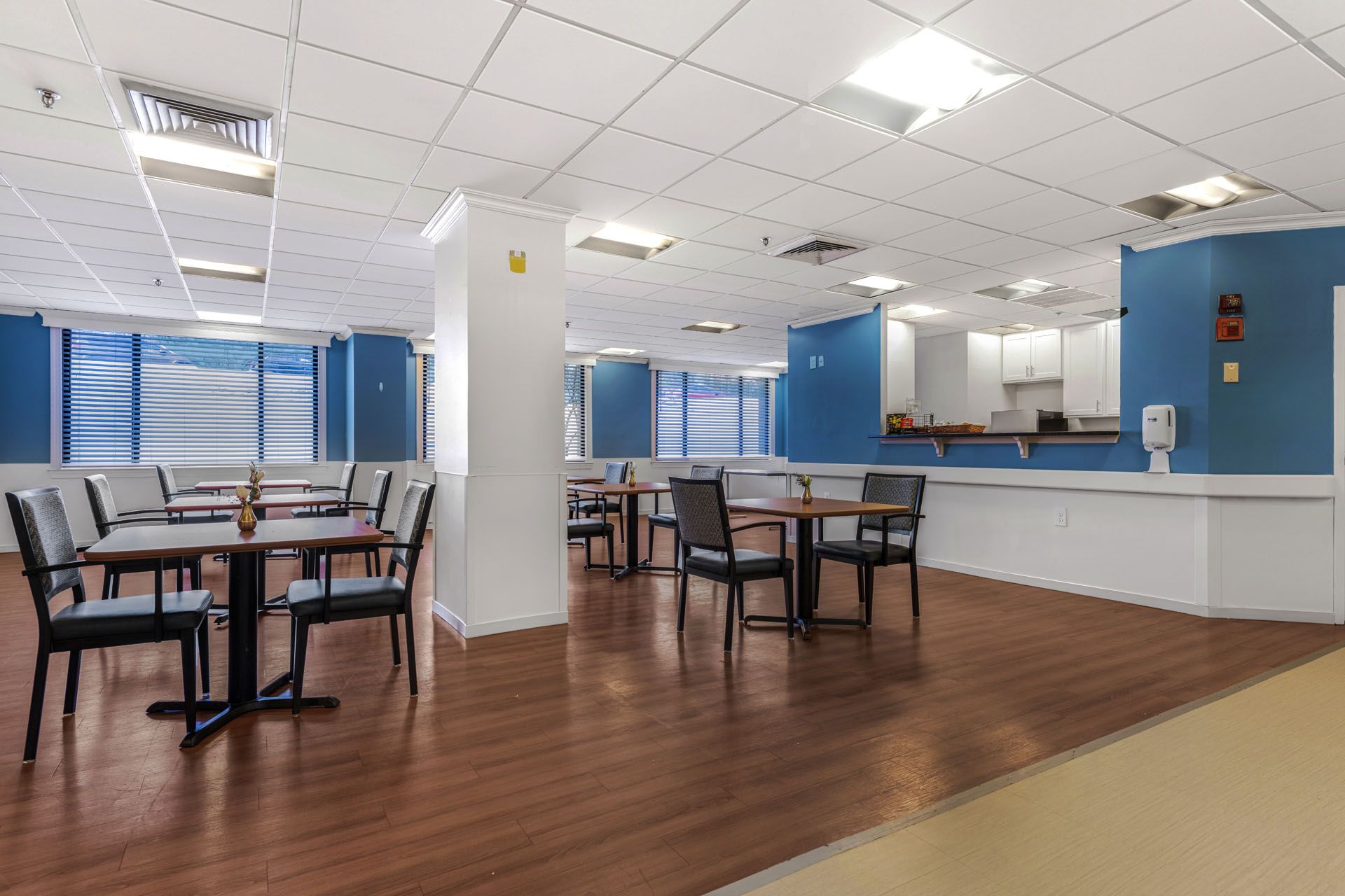 Bright dining area with tables and chairs