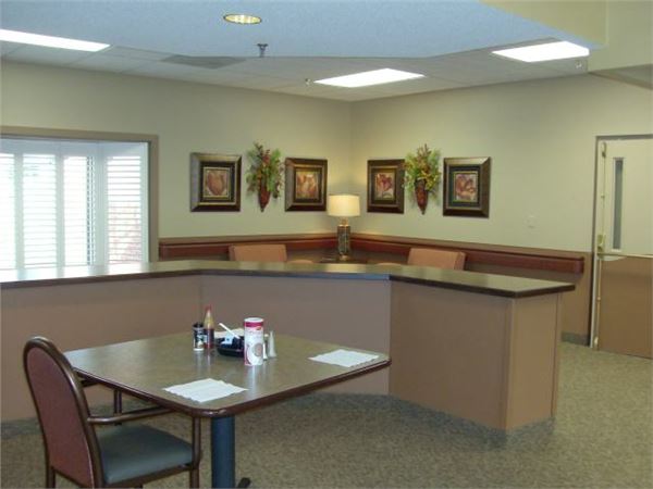 Brightly lit reception area with seating and decor