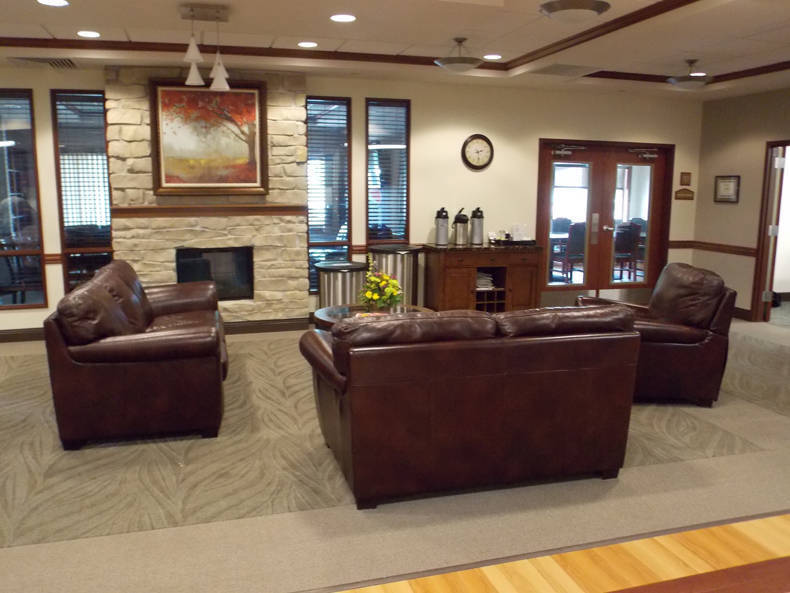 Cozy seating area in a common room with fireplace
