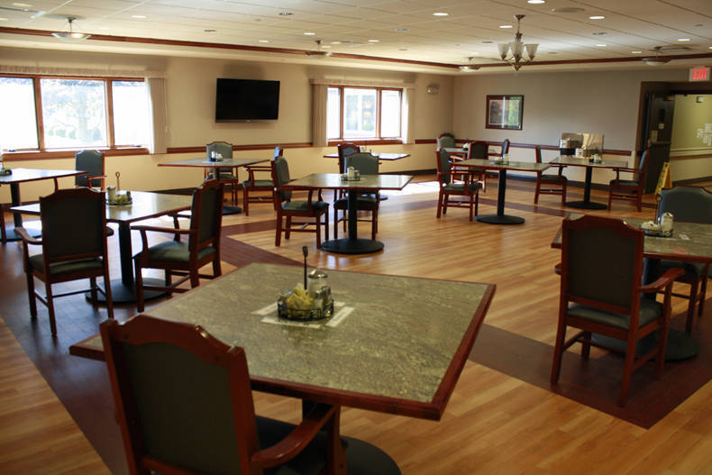 Dining room area with tables and chairs