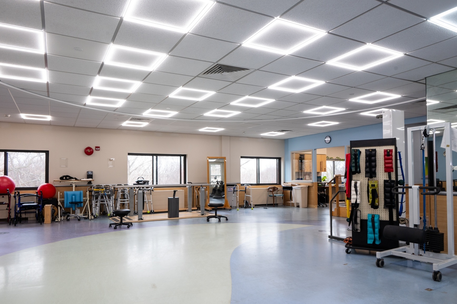 Interior view of a rehabilitation gym with exercise equipment