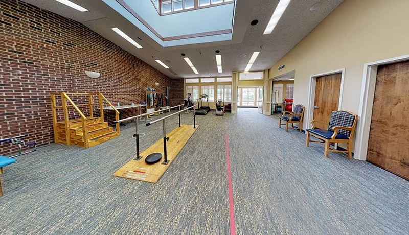Interior view of a rehabilitation space with therapy equipment