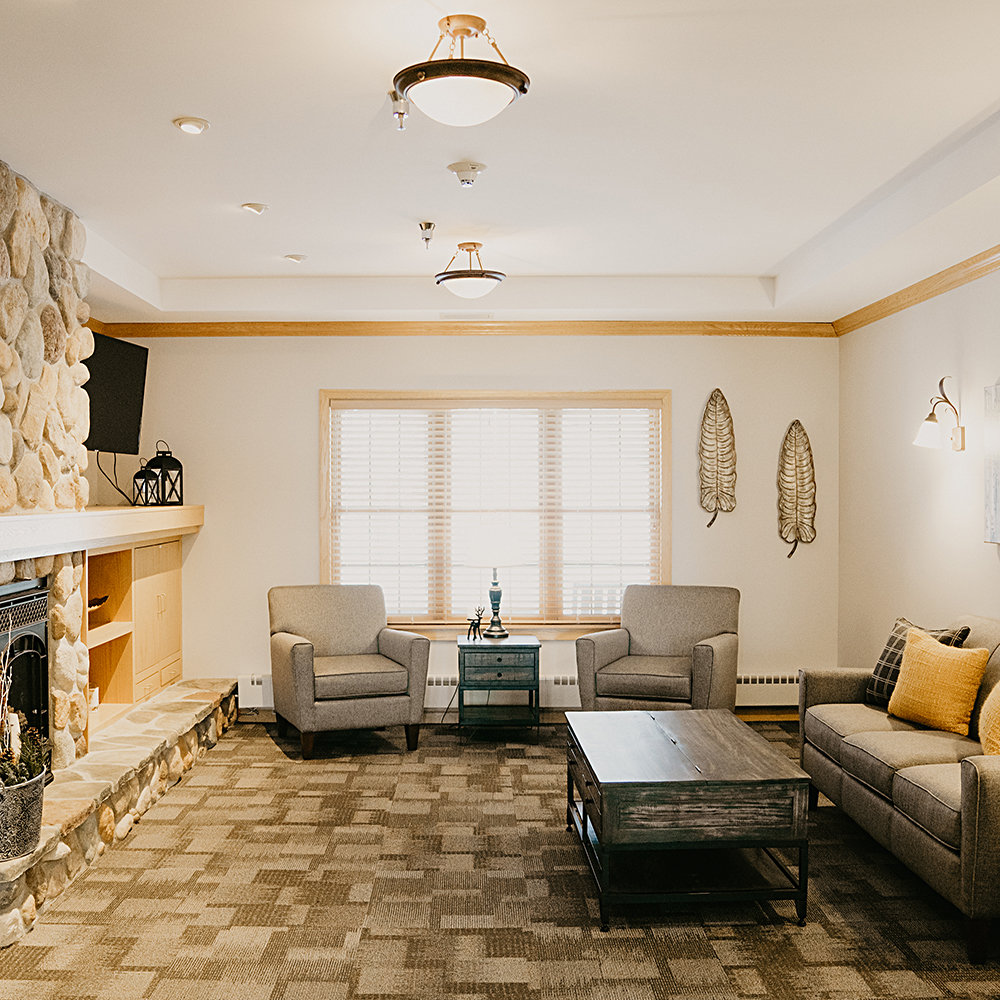 Cozy common area with comfortable seating and a fireplace