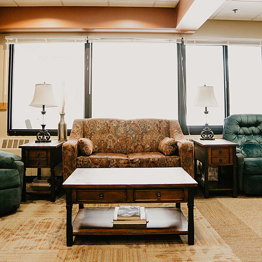 Common area with cozy seating and natural light