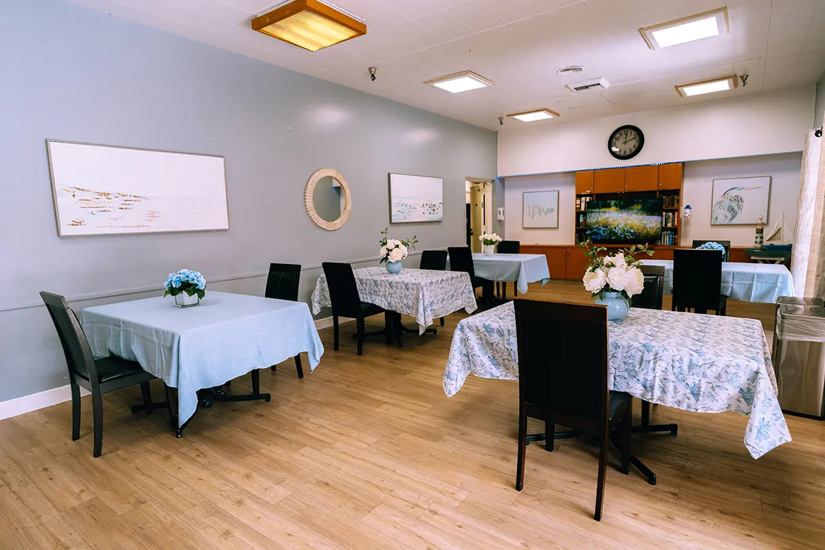 Dining area with tables set for residents
