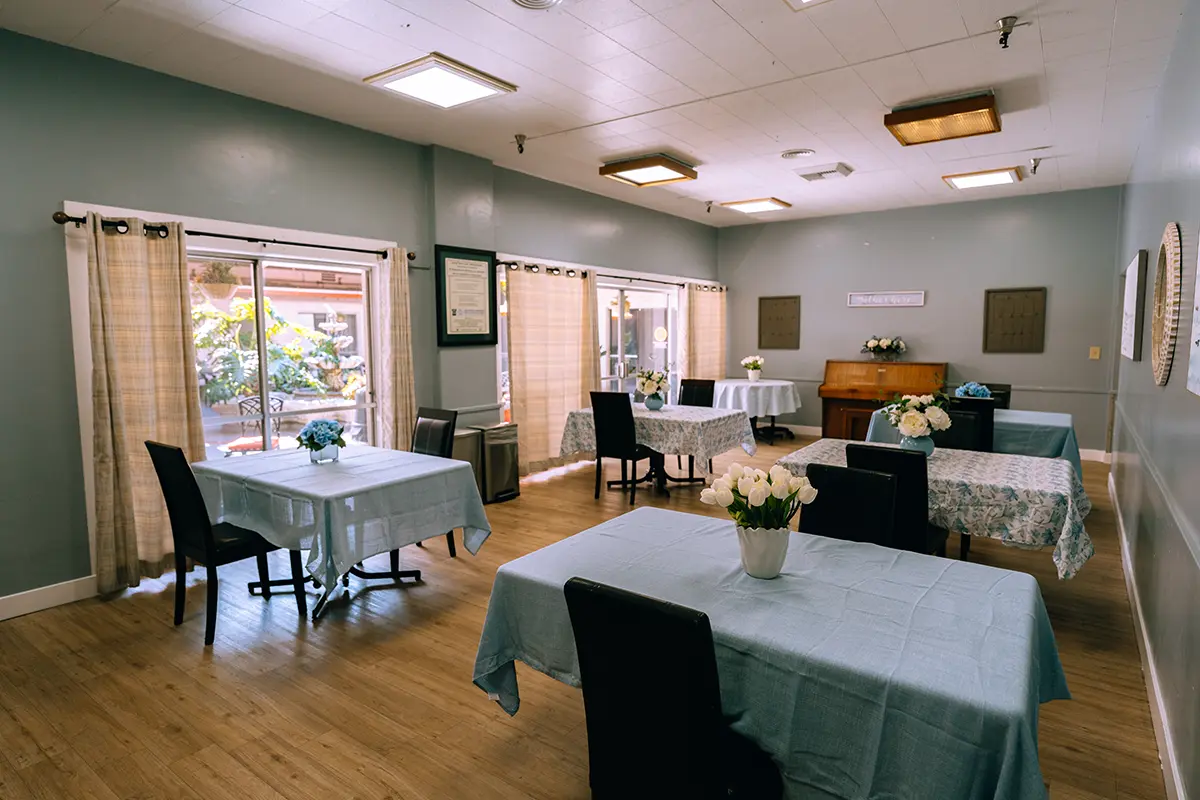 Bright common area with tables and chairs