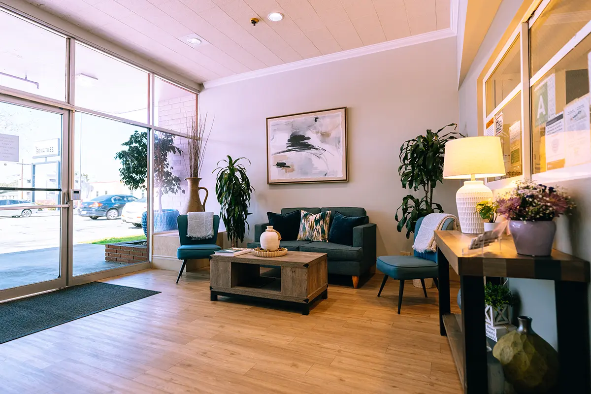 Lobby area with seating and plants.