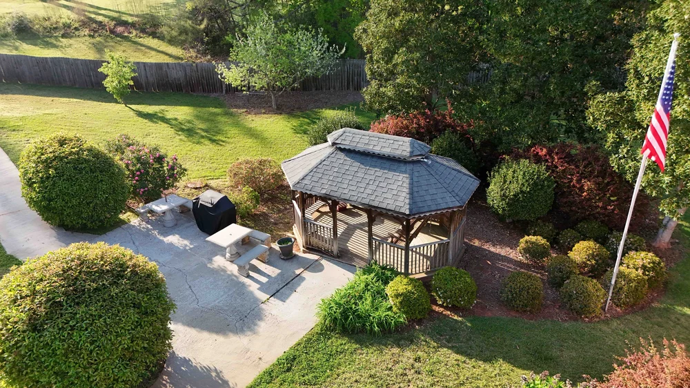 Aerial view of a gazebo in a landscaped garden