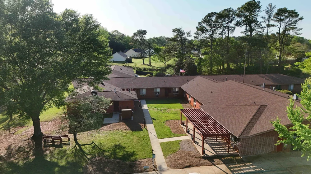 Aerial view of a nursing home with landscaped grounds