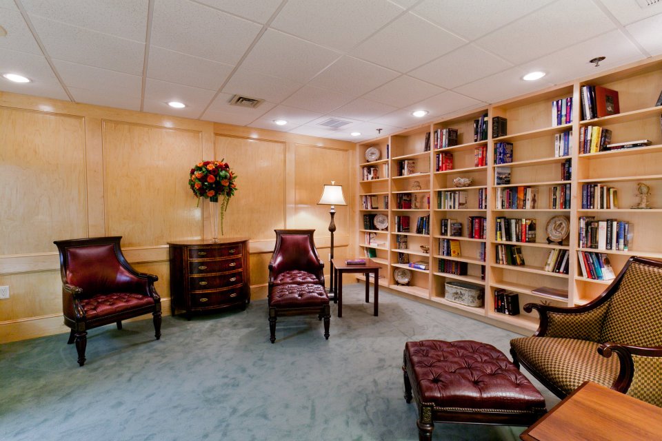 Interior common area with bookshelves and seating