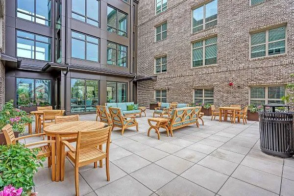 Outdoor seating area with tables and plants