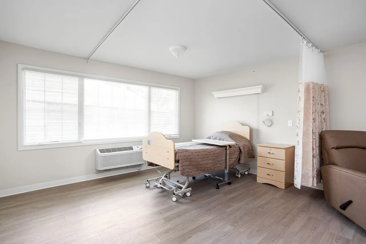 A private resident room with a hospital bed