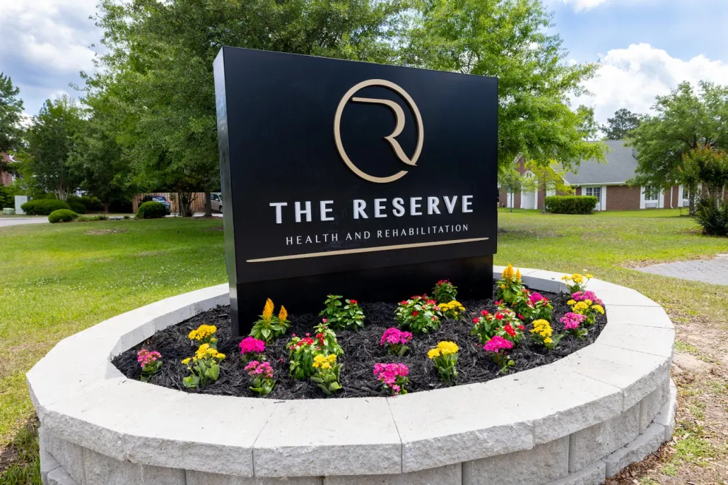 Outdoor facility sign in a landscaped area
