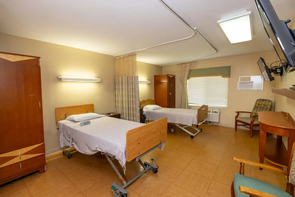 A double resident room with two beds and storage