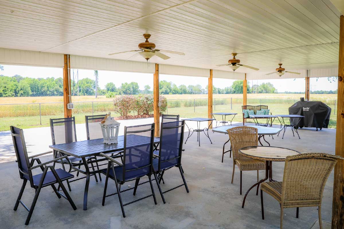 Covered outdoor space with tables and chairs