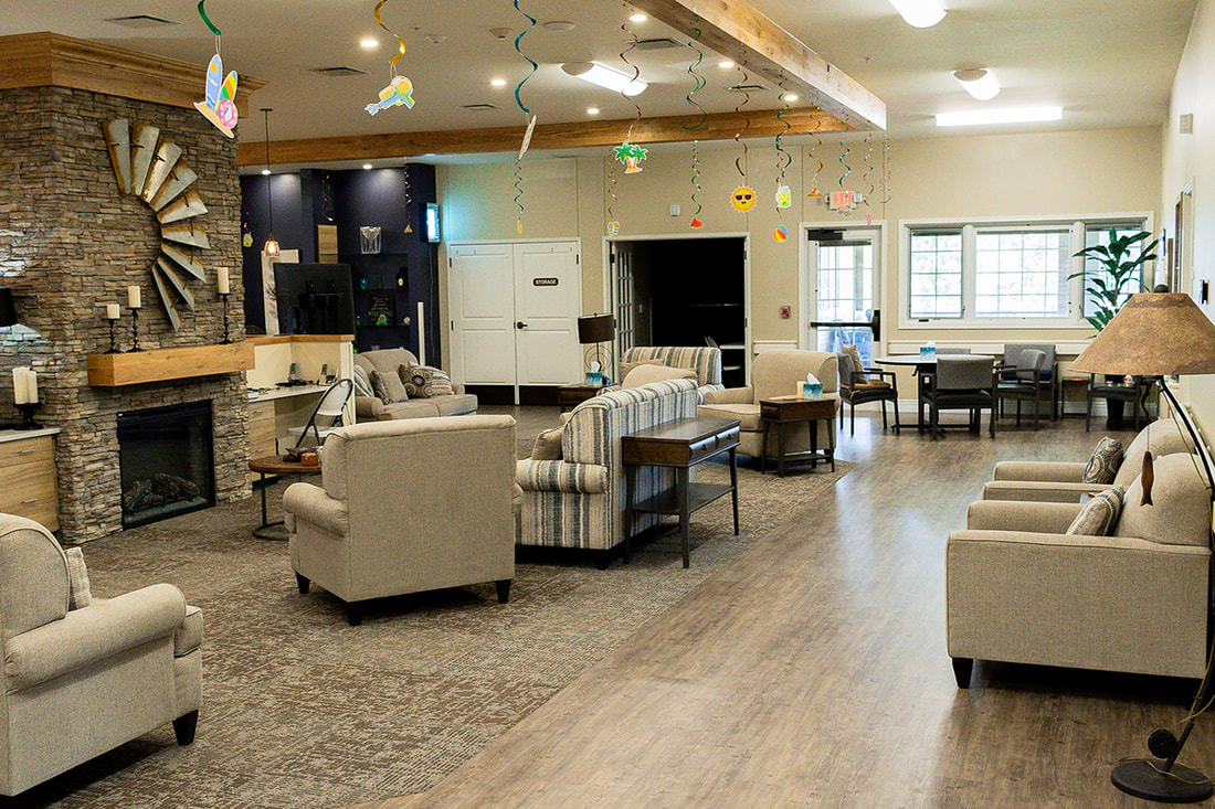 Interior view of a bright common area with seating