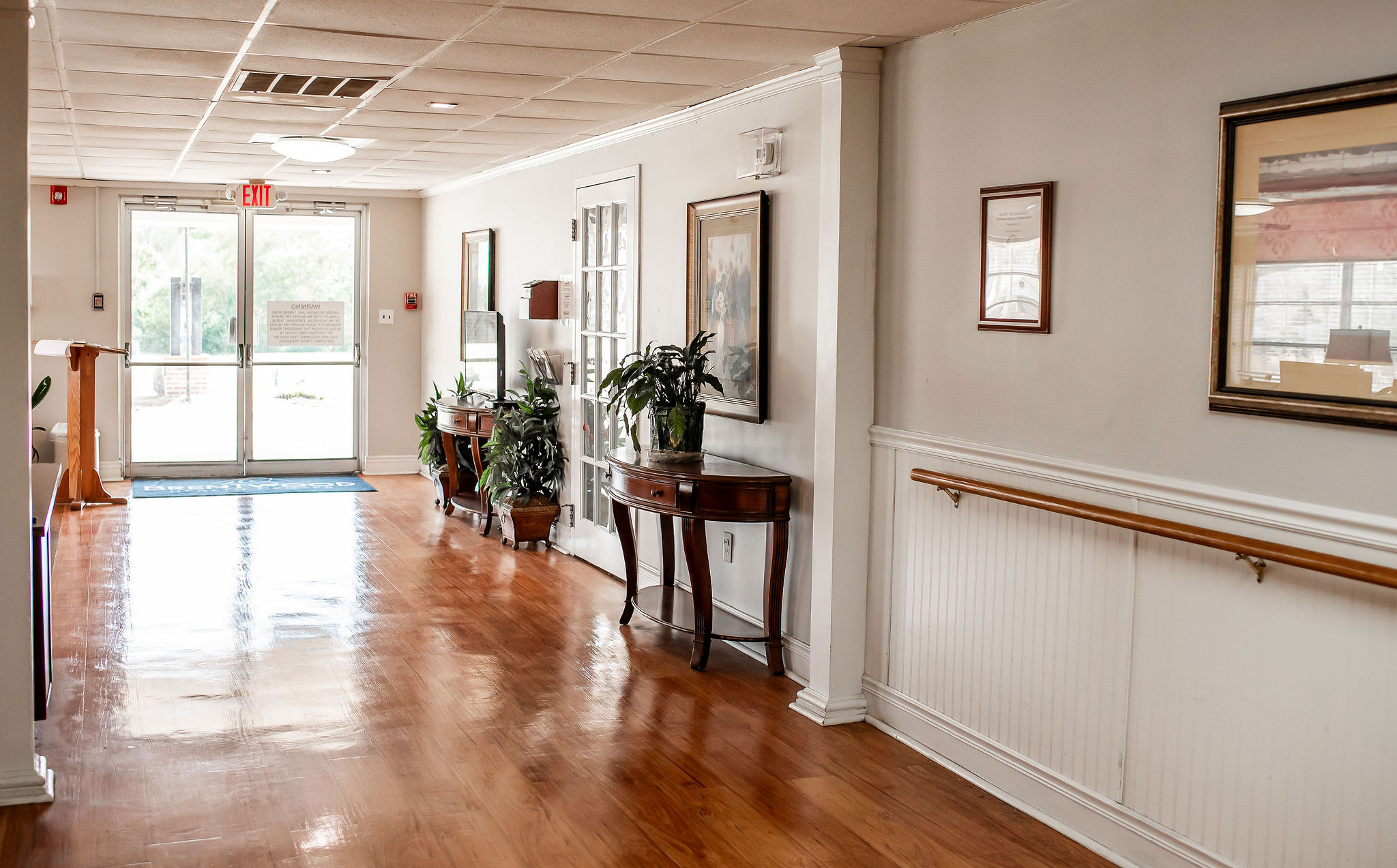 Hallway with wooden floor and plants