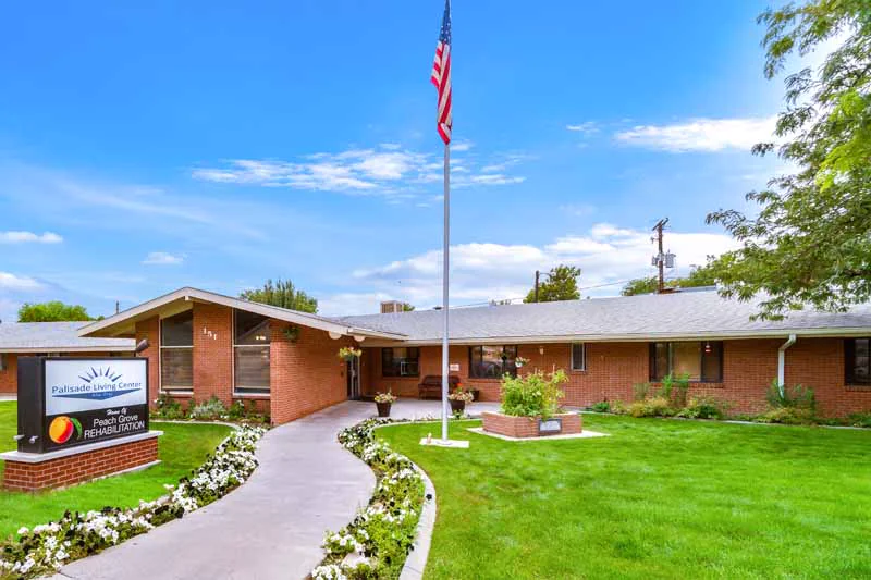 Front entrance of a nursing home building with flowers