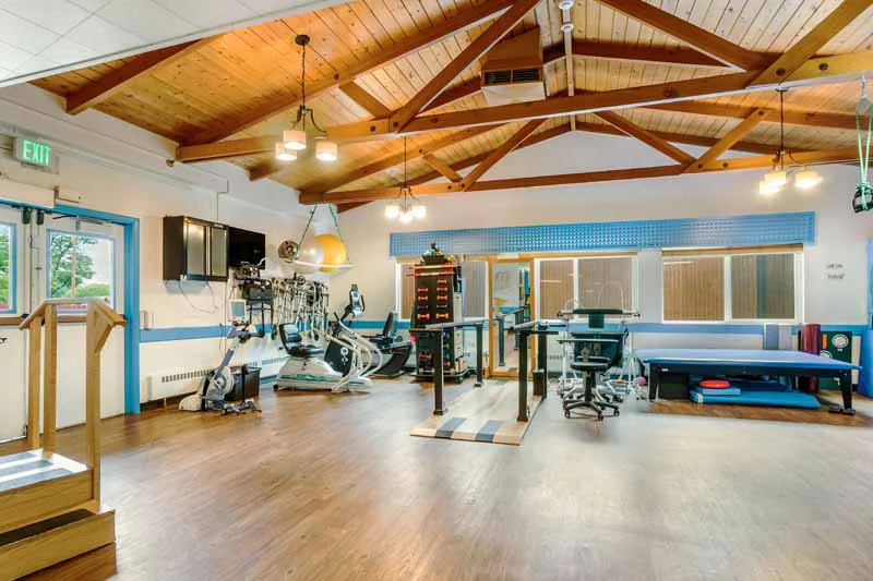 Interior view of a rehabilitation gym with exercise equipment