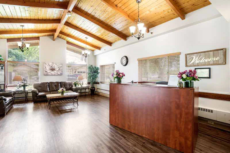 Interior view of a welcoming lobby with wooden beams