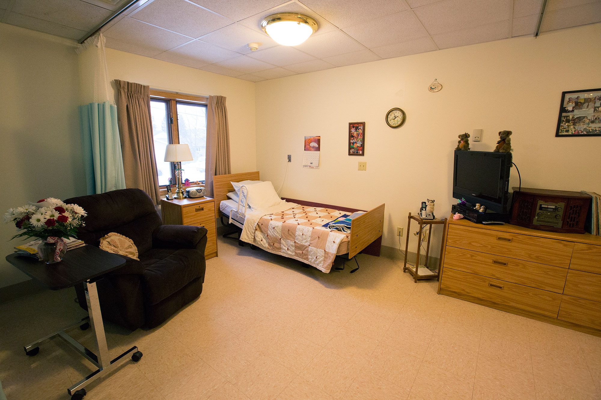 Private resident room with bed and furniture
