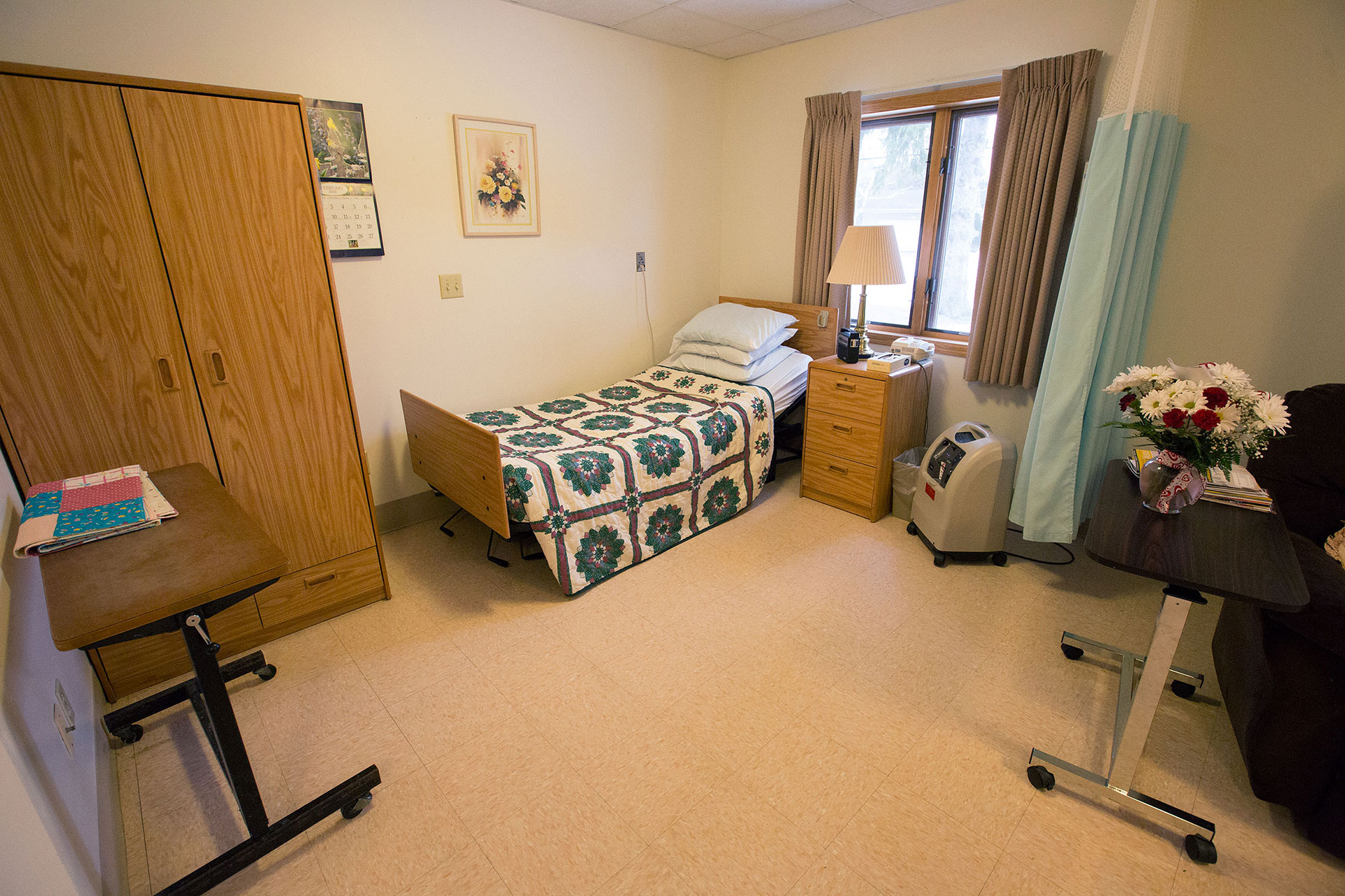 Private resident room with bed and furnishings