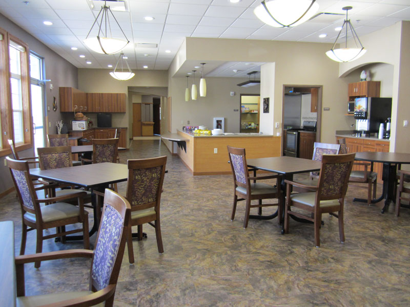 Bright dining room with tables and chairs