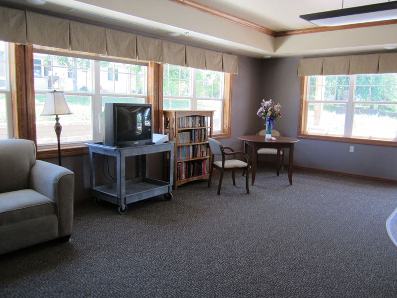 Common area with seating and bookshelves