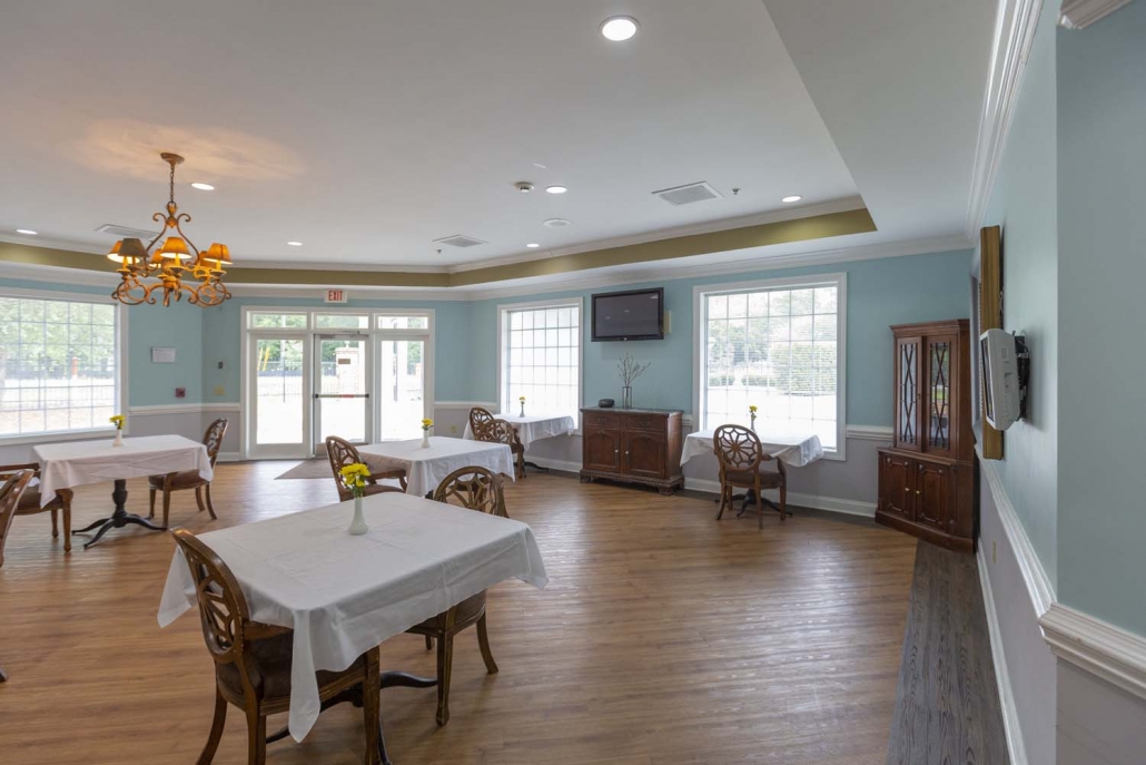 Bright dining room with tables set for meals