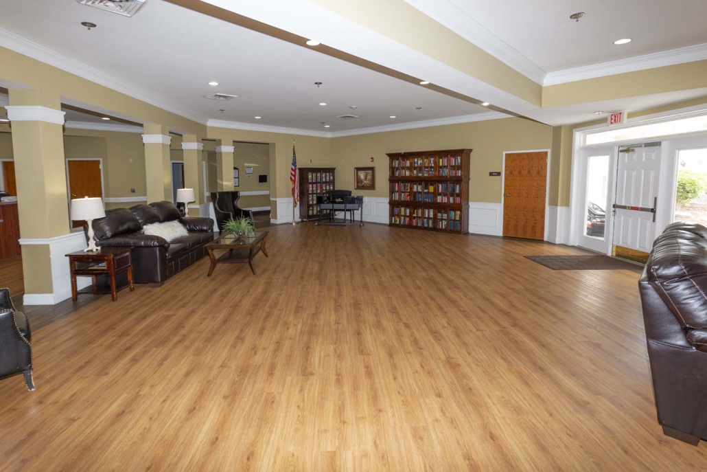 Bright interior view of a common area with seating and shelves