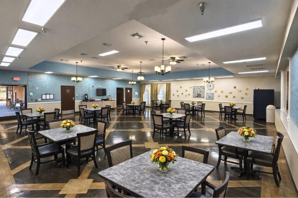 Dining area with tables and flower centerpieces
