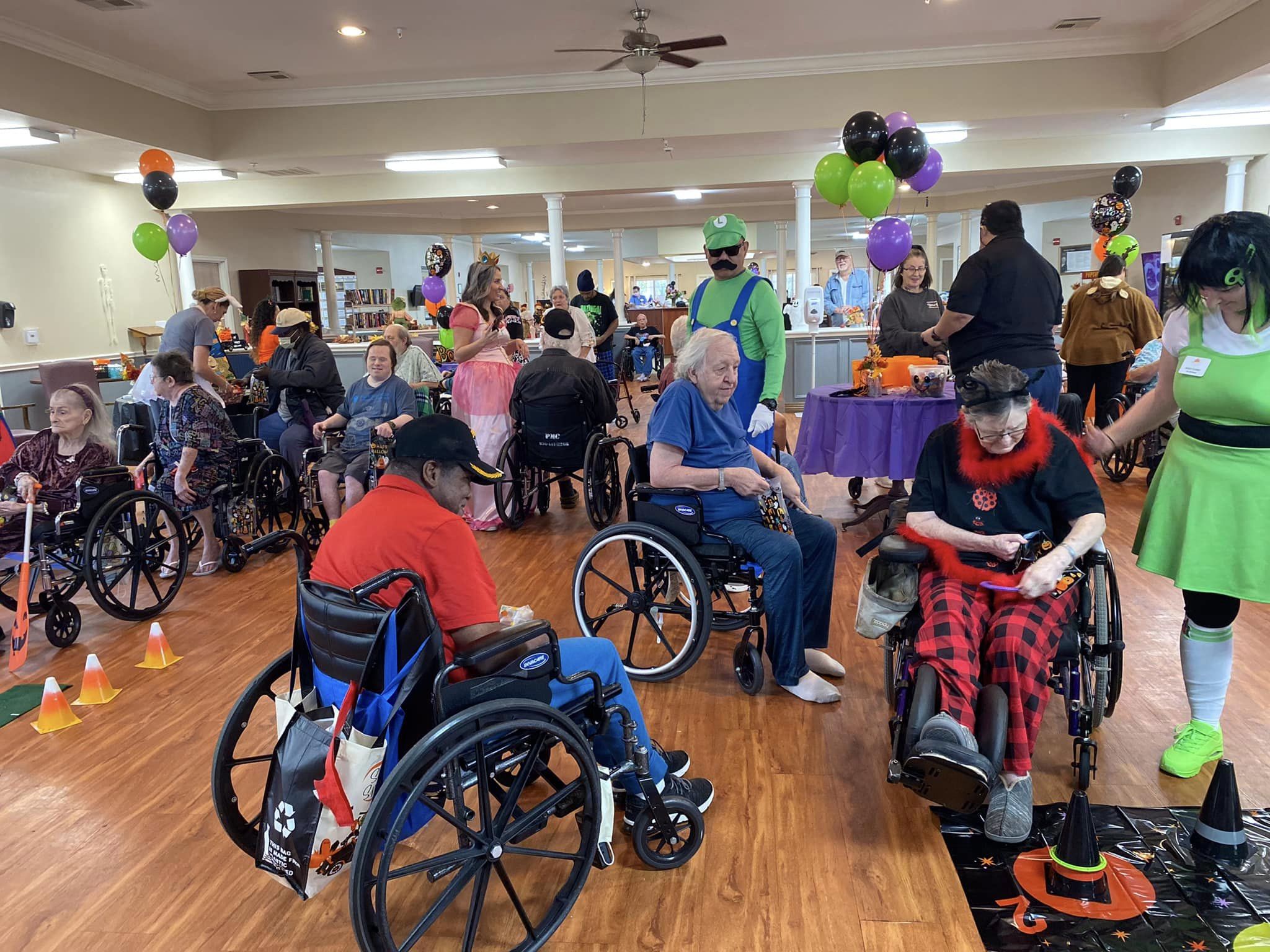 Residents enjoying a Halloween-themed activity.