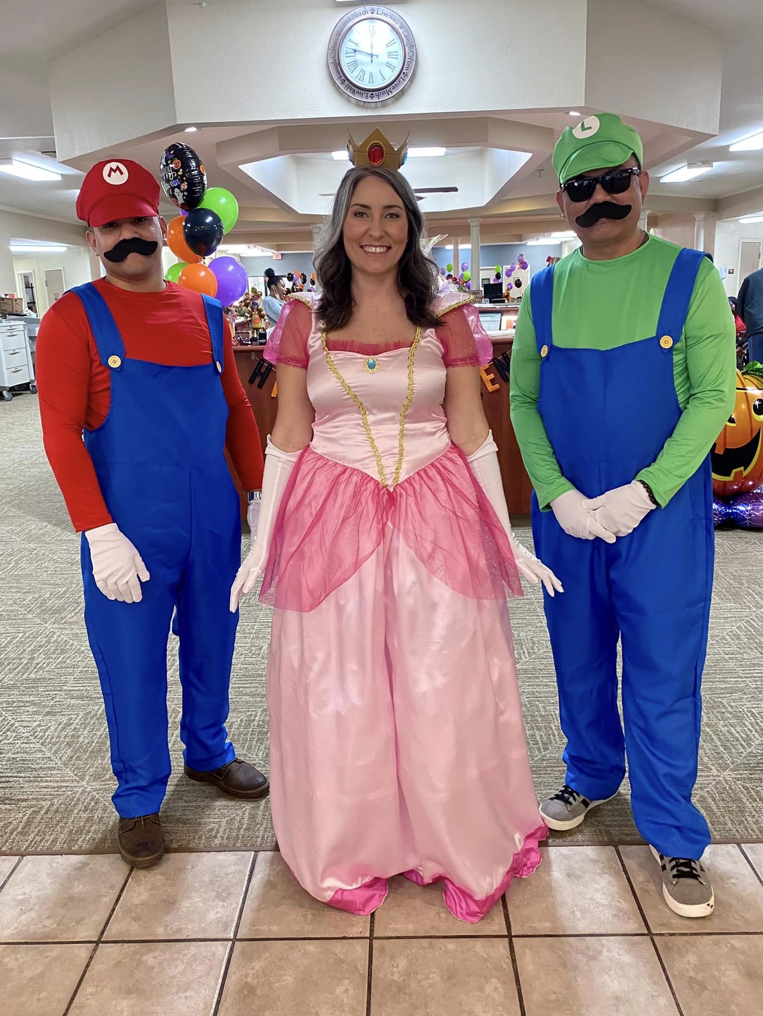 Residents in costumes celebrating a themed event