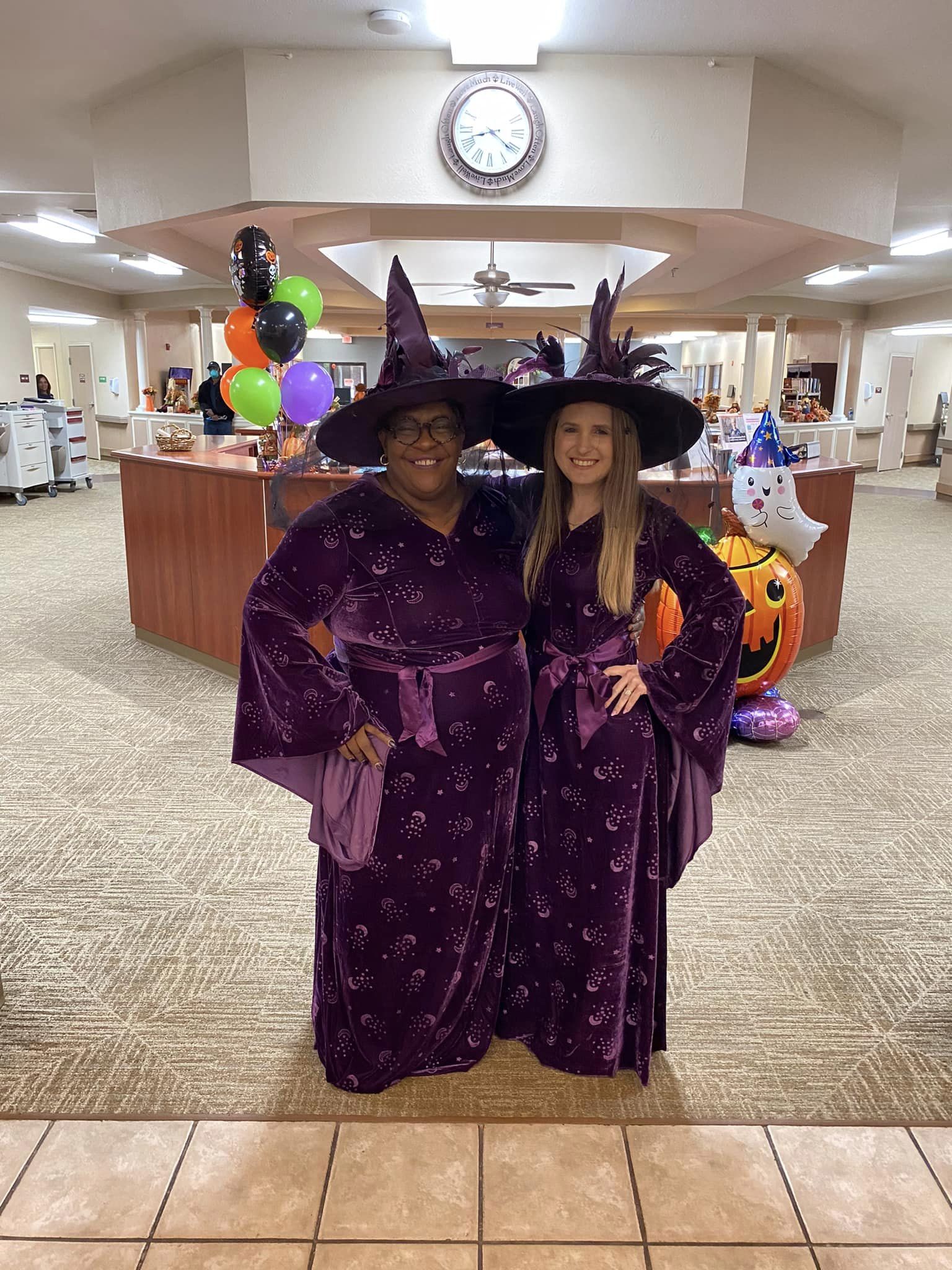 Staff in witch costumes inside the facility