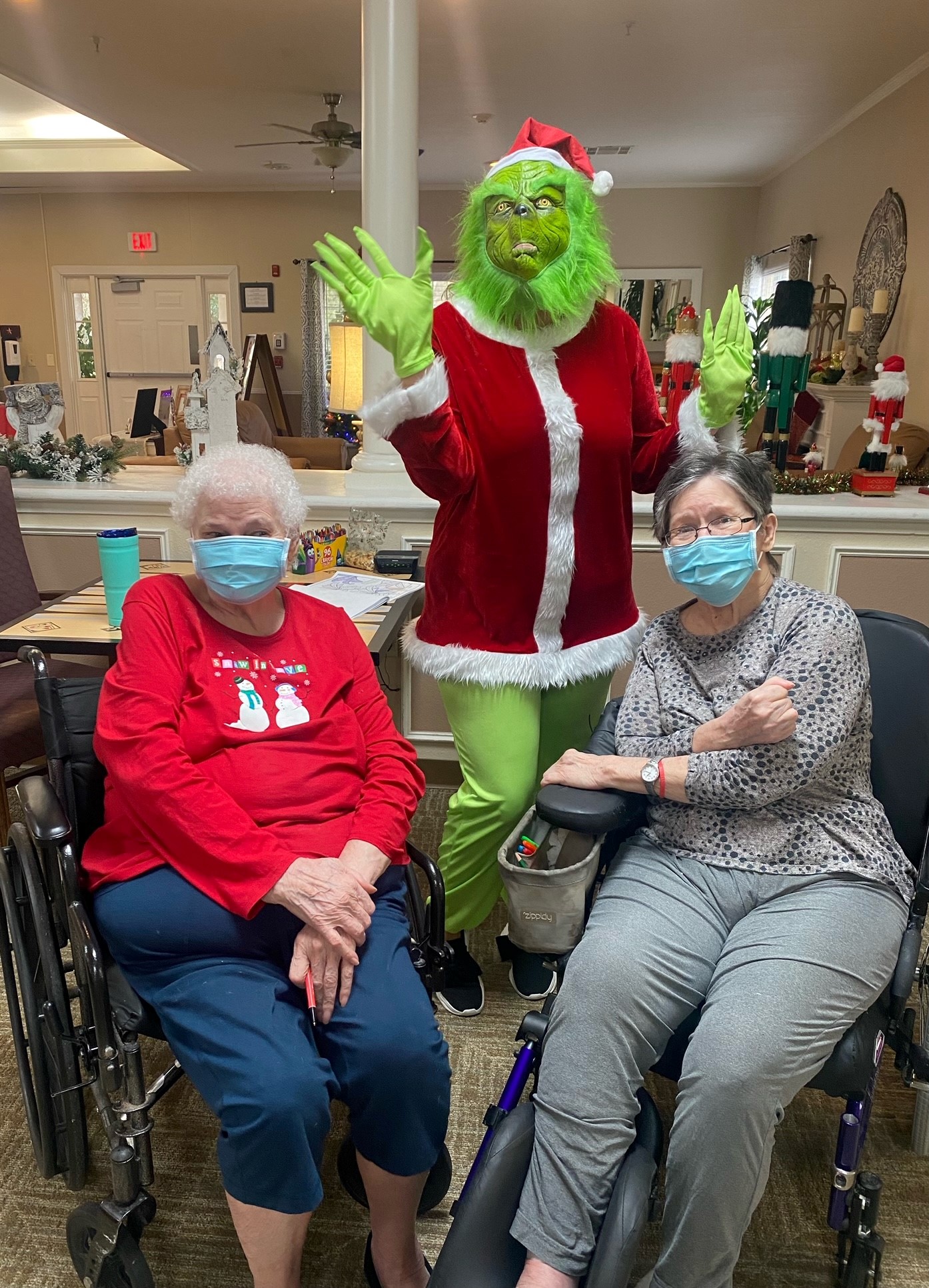 Residents enjoying a festive activity with the Grinch.