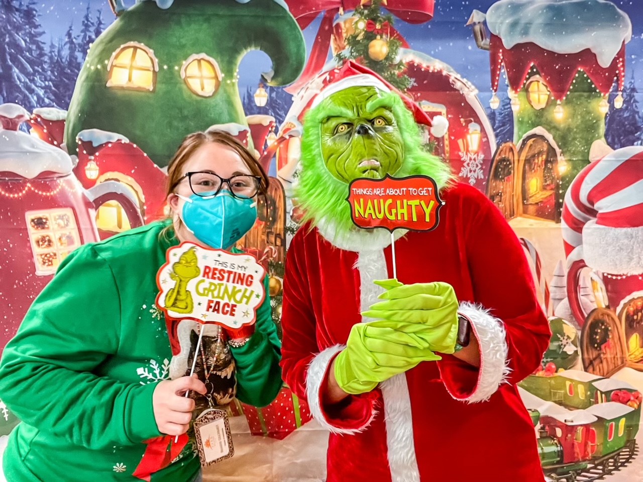 Staff member and resident in Grinch costumes
