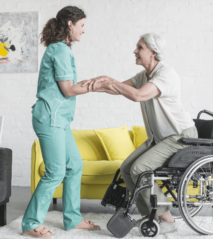 Caregiver assisting a resident in a wheelchair