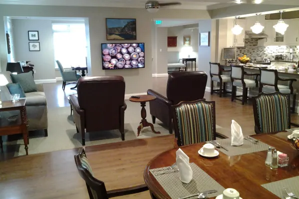 Interior view of a common area with seating and kitchenette