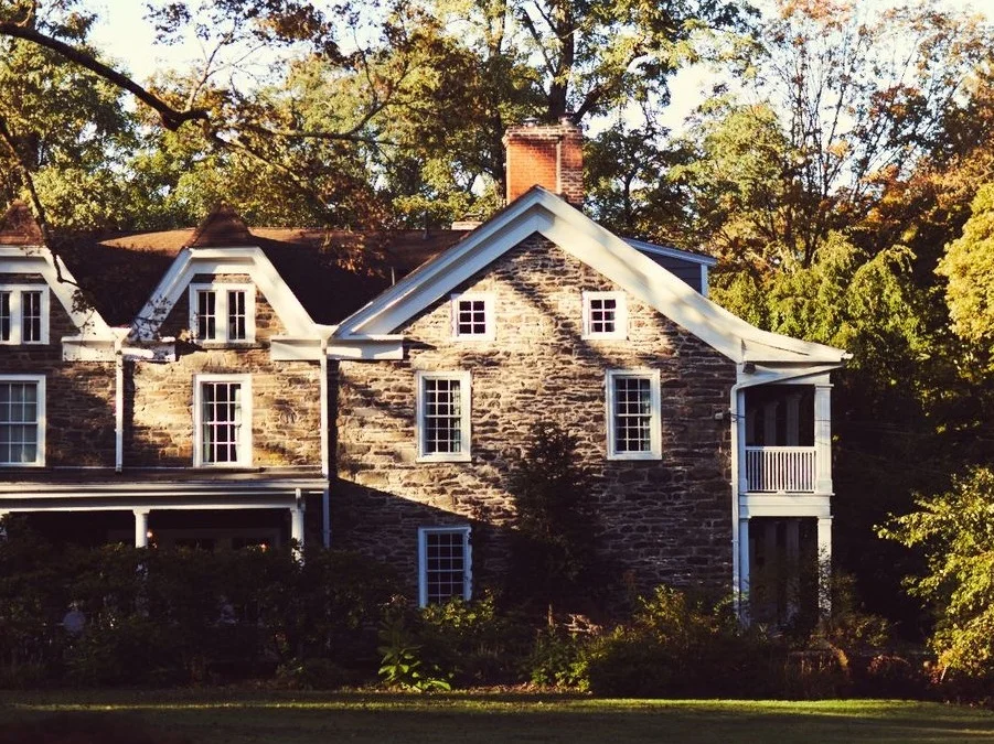Exterior view of a historic building surrounded by trees