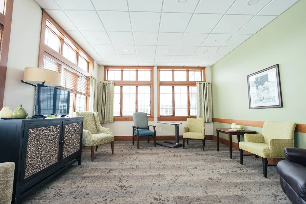 Bright interior common area with furniture and windows
