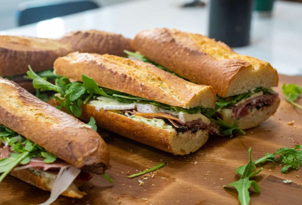 Freshly made sandwiches on a wooden board