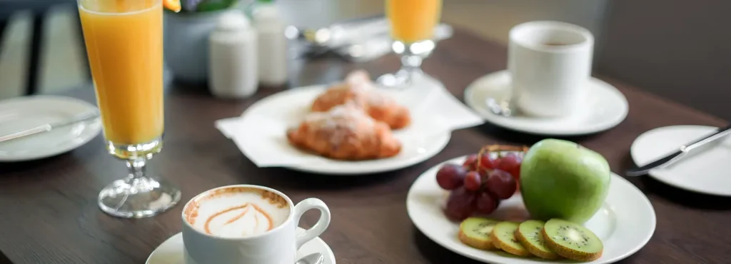 A beautifully arranged breakfast table with coffee and pastries