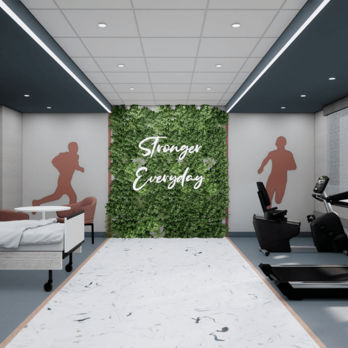 Interior fitness room with greenery and motivational sign