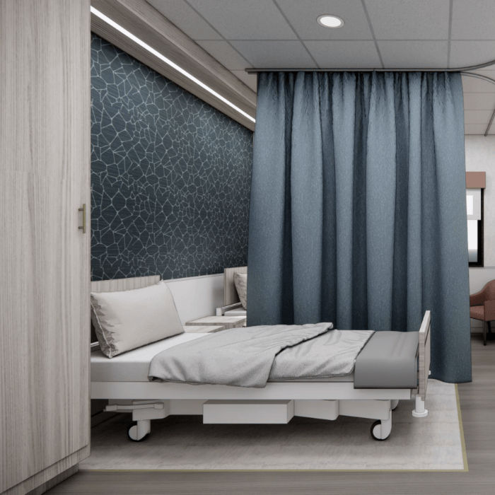 A well-furnished private resident room with bed and curtains